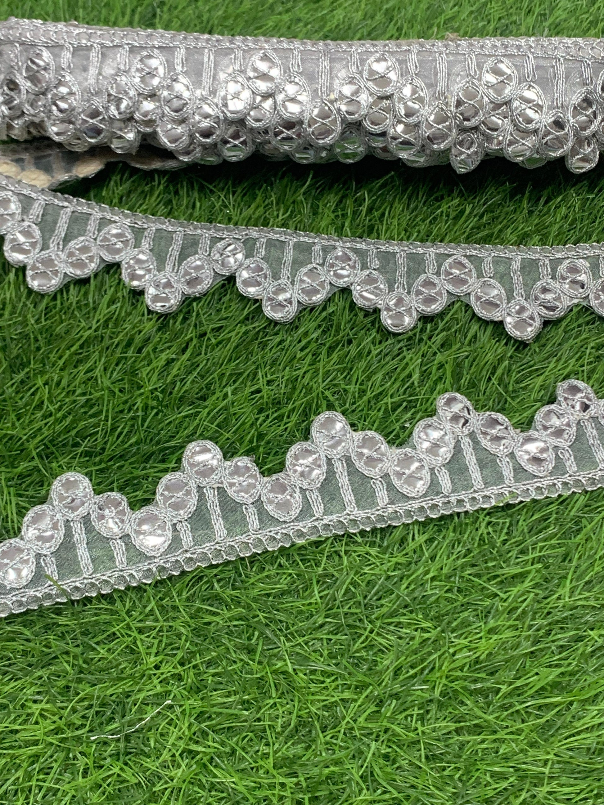 A New Embroidery Lace In Silver With Gota Goli In 1.75 Inch Size And 9 Mtrs Length. - Image 1