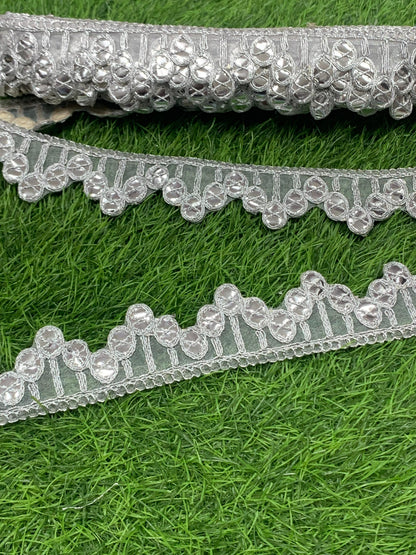 A New Embroidery Lace In Silver With Gota Goli In 1.75 Inch Size And 9 Mtrs Length. - Image 1